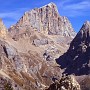 A wide view from above Val Contrin of the extensive southern faces of the Marmolada group of mountains.